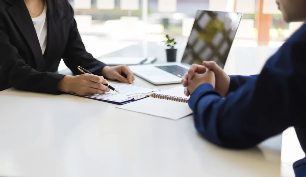 the-manager-is-reading-the-resume-and-is-interviewing-the-new-employee-negotiating-business-and-signing-a-contract-lawyer-and-legal-advisor