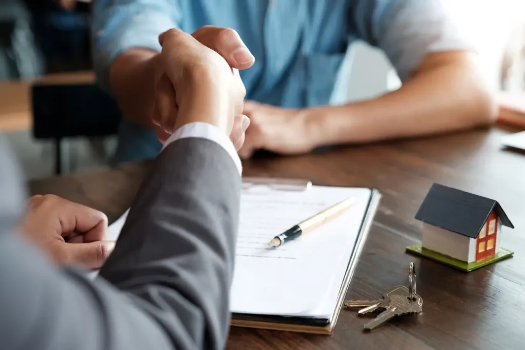 estate-agent-shaking-hands-with-his-customer-after-contract-signature