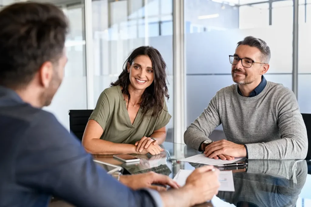 smiling-mature-couple-meeting-with-bank-manager-for-investment-beautiful-mid