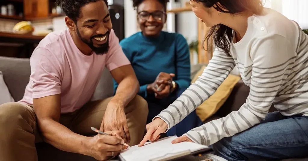 Multiracial couple buying a flat, house from Asian real estate agent.