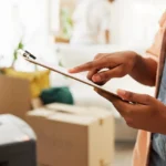 Clipboard, moving and hands of woman in new home