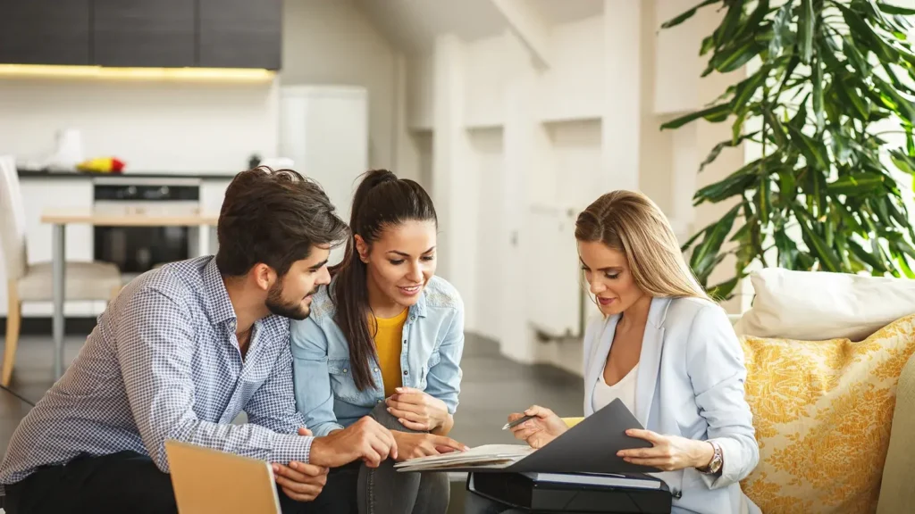 Female Real Estate agent offers home comps to young couple