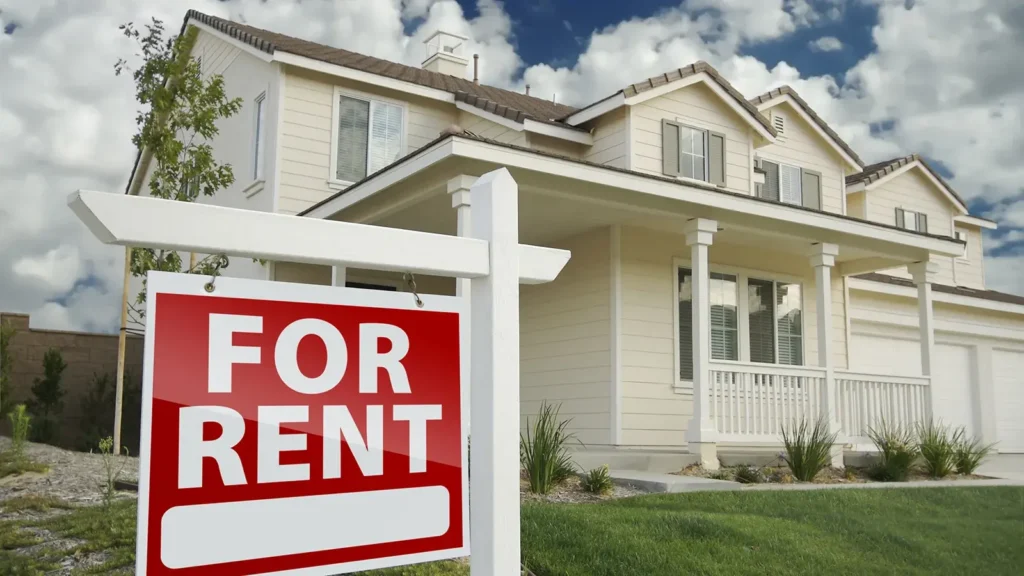 For Rent Real Estate Sign in Front of House
