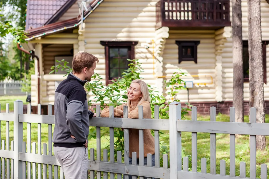 Middle aged man meeting smiling female neighbor