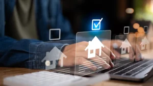 real estate investor compares digital home listings on laptop