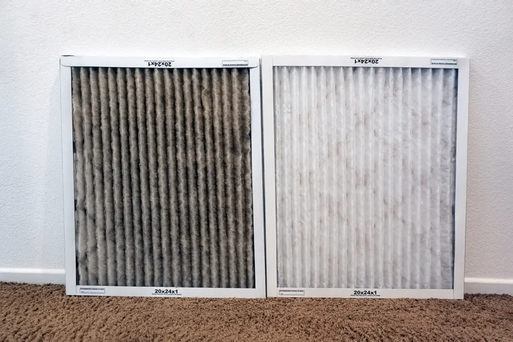 Two AC filters side-by-side. One is clogged with dark dust, while the other is clean and white.